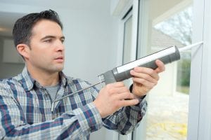 be a better homeowner by caulking around windows to prevent drafts